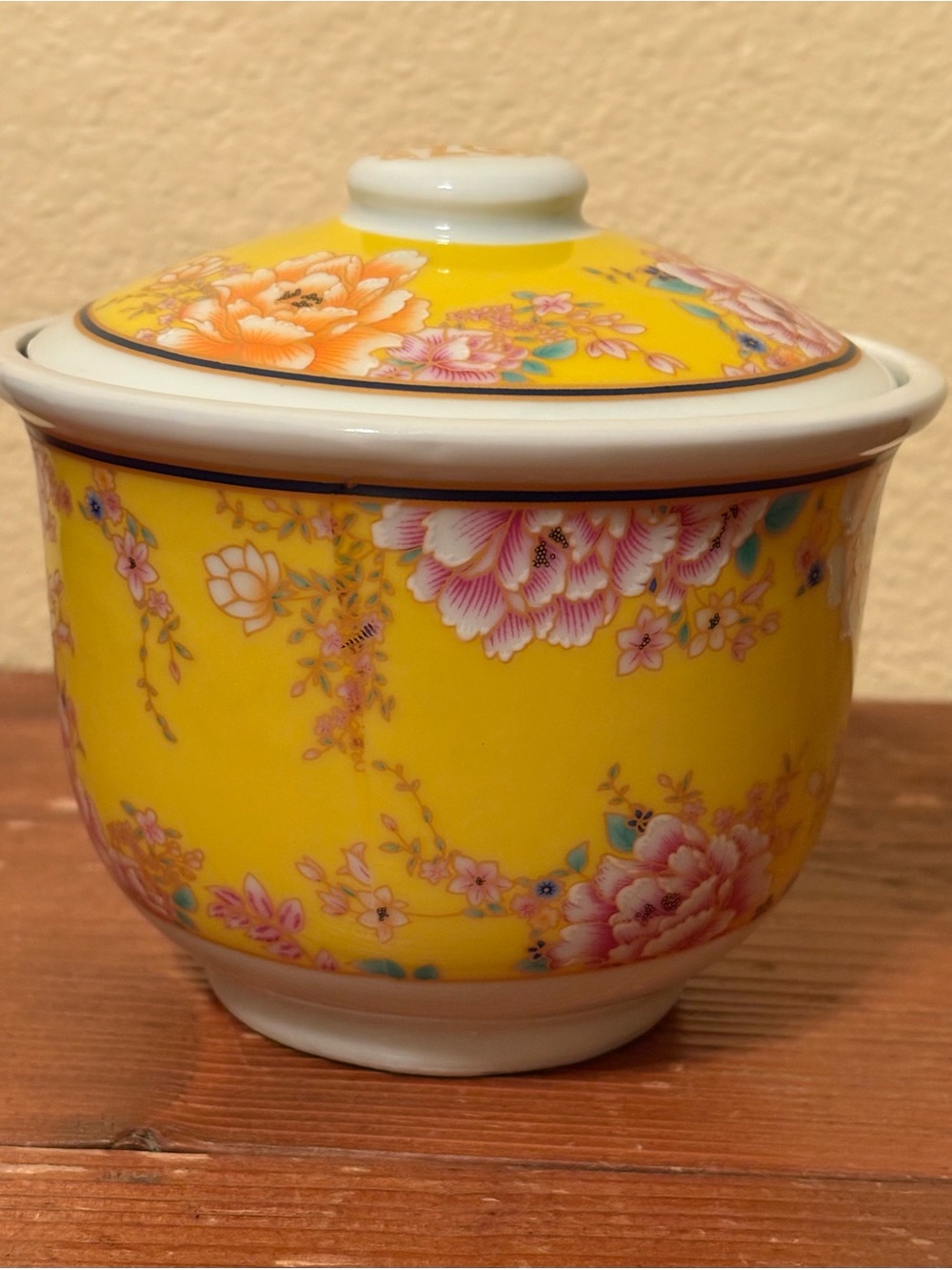 A decorative Chinese porcelain yellow-ground floral gaiwan tea jar
